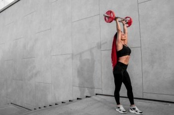 Fitness, body builder and woman with barbell training, workout or challenge exercise for muscle power, energy and goal. Strong, power and sports person with gym motivation and bodybuilder challenge