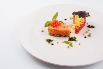 salmon and beef tartare on white plate
