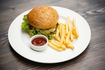 menu with delicious juicy burger and fries with sauce on a plate