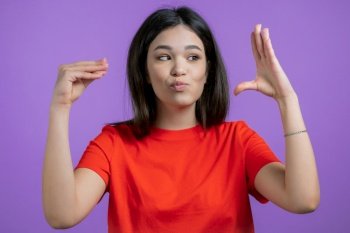 Pretty mixed race woman showing bla-bla-bla gesture with hands isolated on purple background. Empty promises, blah concept. Lier. High quality photo. Pretty mixed race woman showing bla-bla-bla gesture with hands isolated on purple background. Empty promises, blah concept. Lier.