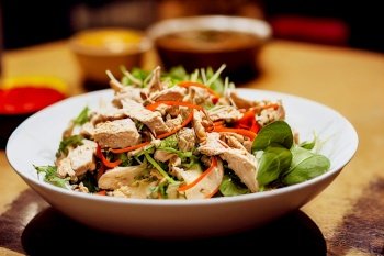 Vertical shot of a Thai style chicken salad 3d illustrated