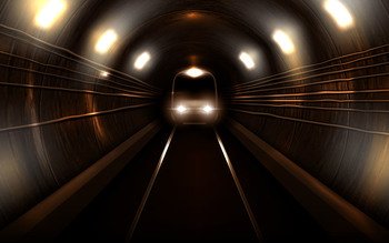 Subway train with glowing headlights in old rusty metro tunnel front view, locomotive on rails. Modern underground commuter transport, railway passenger vehicle, Realistic 3d vector illustration. Subway train in metro tunnel front view locomotive