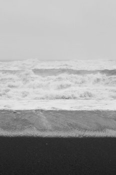 Ocean water swirling at storm monochrome landscape photo. Beautiful nature scenery photography with sky on background. Idyllic scene. High quality picture for wallpaper, travel blog, magazine, article. Ocean water swirling at storm monochrome landscape photo