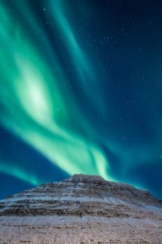 Mountain and aurora borealis at night landscape photo. Beautiful nature scenery photography with sky on background. Idyllic scene. High quality picture for wallpaper, travel blog, magazine, article. Mountain and aurora borealis at night landscape photo