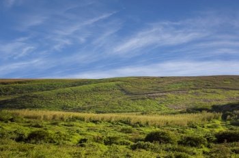 picture of a hill with clouds and blue sky, picture of a hill with blue sky in the background