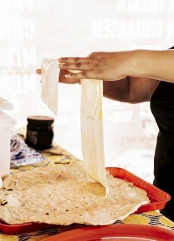 Preparation of traditional Nicaraguan cheese, Preparation of traditional Nicaraguan cheese. Nicaraguan cheese made and served. Traditional cheese with pickled onion.