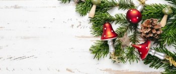 Top view of Christmas decorations in mushrooms shape on white wooden background. Top view of Christmas decorations in mushrooms shape