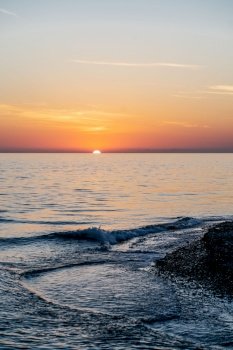 Sunset over the sea. A beautiful natural sunset landscape that will definitely come in handy.. Beautiful sunset landscape on the blue sea.