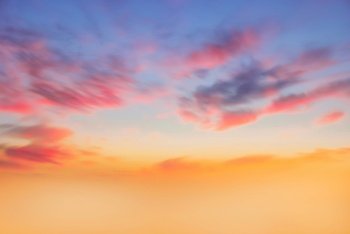 Real amazing panoramic sunrise or sunset sky with gentle colorful clouds. Long panorama, crop it