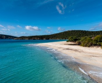 A view of the beautiful wihtie sand beach and turquoise waters at Turredda Beach in Sardinia