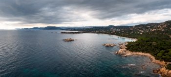 panorama drone view of Palombaggia Beach and hilly coastline in southeastern Corsica