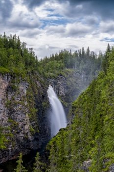 A vertical view of the Hallingsafallet waterfall in northern Sweden