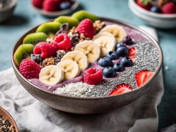 A refreshing, fruit-filled smoothie bowl, brimming with an array of colorful berries, banana slices, and chia seeds.