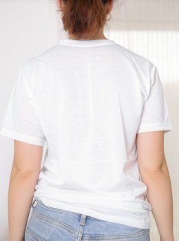 Female model wearing a white t-shirt, back view. T-shirt mockup, template for picture, text or logo. Free space, copy space. Female model wearing a white t-shirt, back view. T-shirt mockup, template for picture, text or logo. Free space, copy space.