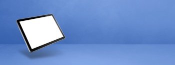 Blank tablet pc computer floating over a blue background. 3D isolated illustration. Horizontal banner template. Floating tablet pc computer isolated on blue. Horizontal banner background