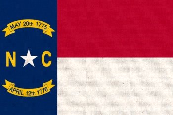 Flag Of North Carolina. Flag of American state North Carolina. Symbol of North Carolina. American state. Fabric Texture. Flag Of North Carolina. Flag of American state North Carolina. Fabric Texture