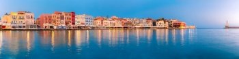 Picturesque panoramic view of old harbour with Lighthouse of Chania at sunrise, Crete, Greece. Old harbour at sunrise, Chania, Crete, Greece