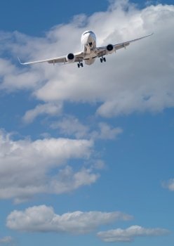 Passenger Airplane In Approach for Landing with Beautiful Blue Sky.