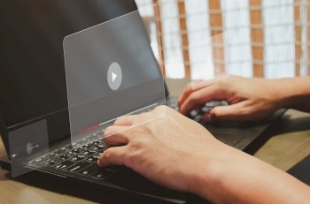 Man using computer laptop  virtual icon watching video on internet. modern Internet technology , Social Networking, online marketing, digital online.  concept technology