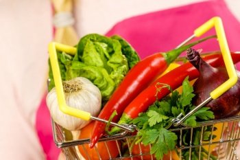 Shopping basket with many colorful vegetables. Healthy eating lifestyle, nutrients vegetarian food.. Shopping backet with dieting vegetables