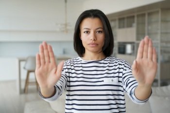 Caucasian woman gesturing no with hands, shows rejection. Girls palms close up. Warning or refusal concept, decline and denial. Negative emotions at home. Stop abuse and domestic violence.. Woman gesturing no with hands, shows rejection. Stop abuse and domestic violence.