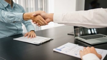 Recruitment concept, Male employer shaking hands with applicant to congratulation for new job.