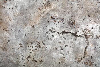 Metal rough texture covered with old weathered swollen beige paint with rust spots, scratches and cracks.. Texture of old weathered beige paint on a metal sheet with rusty spots, cracks and bumps.
