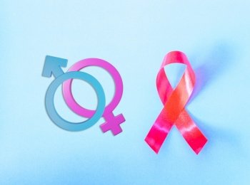 Red Ribbon Support HIV, AIDS and Male and female gender signs
on blue background and copy space for use, activism and relationship of sex concept