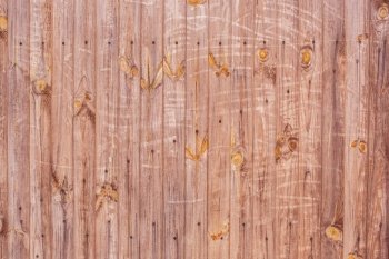 Background texture of an old brown painted wooden wall slab. Background texture of an old wooden wall