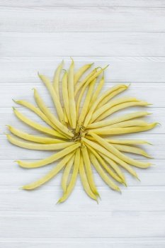 yellow and green beans on a wooden background. yellow and green bean for background