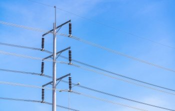 Electric pole and blue sky. Power and energy. Three-phase electric power for transfer power by electrical grids. Global energy crisis concept. Clean energy. Green power for sustainability energy.