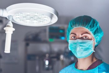 Female surgeon in operating theater. High quality photo. Female surgeon in operating theater