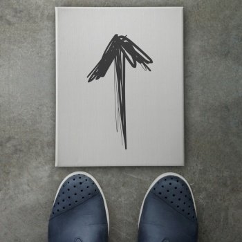 Hand drawn arrow design doodle icon on front of business man feet as concept 