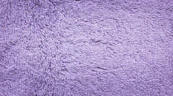 Ultra violet towel texture background. Violet terry towel texture. Violet fibers towel texture. Violet bath towel background.
