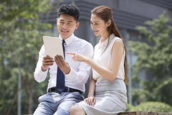 Confident businessmen using a tablet computer