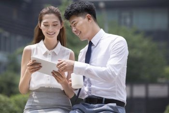 Confident businessmen using a tablet computer
