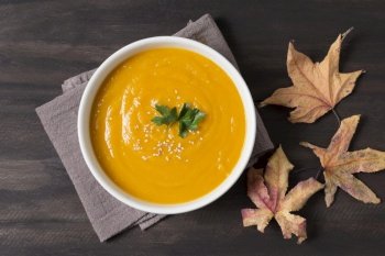 top view cream soup and autumn leaves. Resolution and high quality beautiful photo. top view cream soup and autumn leaves. High quality and resolution beautiful photo concept
