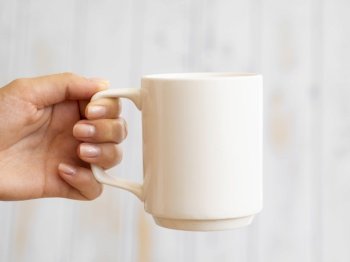 close up hand holding up mug. Resolution and high quality beautiful photo. close up hand holding up mug. High quality beautiful photo concept