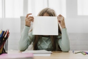 girl holding blank paper front her