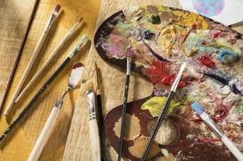 paint palette with brushes spatula
