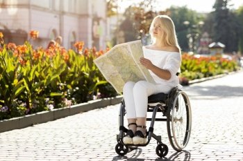 woman wheelchair looking map outdoors