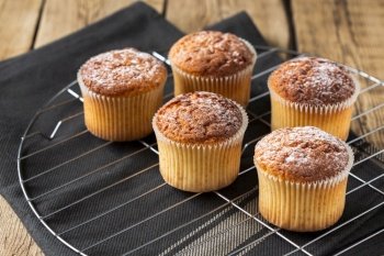 muffins with powdered sugar tray