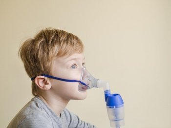 high angle boy with oxygen mask
