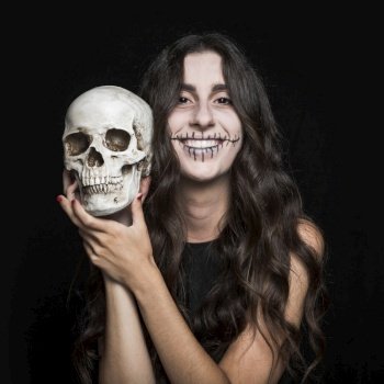 laughing woman holding skull