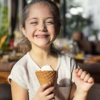medium shot happy girl with ice cream