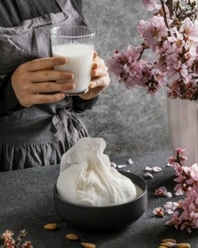 person making almond milk