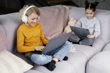 siblings couch with laptop