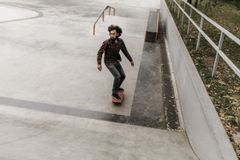 man having fun with skateboard outside