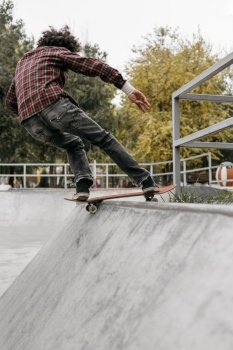 man having fun with skateboard park