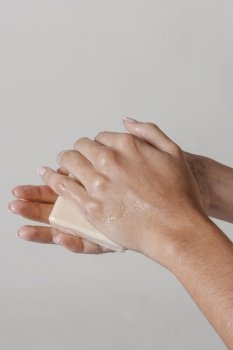 rubbing hands with block soap hygiene concept